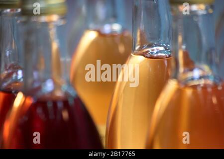 Extreme close up bottles with colored liquid. Stock Photo