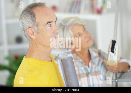 a senior couple facing wall Stock Photo
