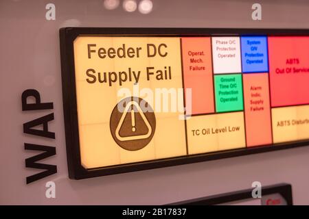 Warning alert message on digital manufacture display. Stock Photo