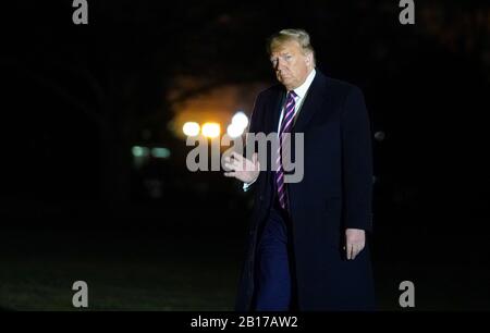 United States President Donald J. Trump waves to the press as he returns to the White House in Washington, DC on February 21, 2020 from Las Vegas where he delivered remarks at a Keep America Great Rally. Credit: Leigh Vogel/Pool via CNP | usage worldwide Stock Photo