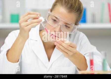 attractive student of chemistry working in laboratory Stock Photo