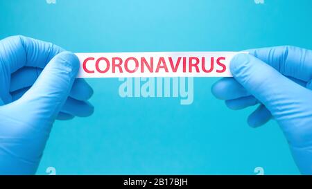 Coronavirus print on blue medical background. Covid-19 - Wuhan Novel Coronavirus pneumonia COVID-19. Healthcare background. Quarantine background. Epidemic. Biotechnology concept. Copy space Stock Photo