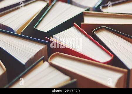 Many hardbound books background, selective focus Stock Photo