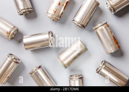 Close up of spent used rechargeable Nickel Metal Hydride (Ni-MH) battery on grey background, flat lay. Old Nickel-Cadmium (Ni-Cd) batteries without a Stock Photo