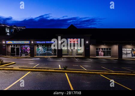 ABBOTSFORD, CANADA - FEBRUARY 10, 2020: retail store strip mall in early morning. Stock Photo