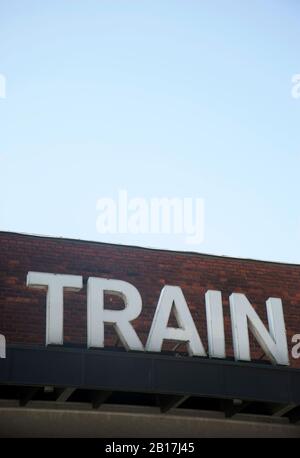 Denmark, Aarhus, Low angle view of clear sky over train station sign Stock Photo