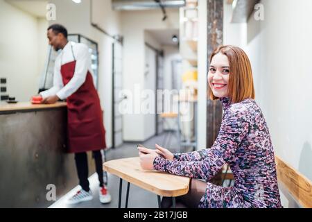 Portrait of smiling woman in a cafe Stock Photo