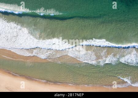 Aerial view of the crashing waves on Nobbys Beach - Newcastle - NSW Australia Stock Photo