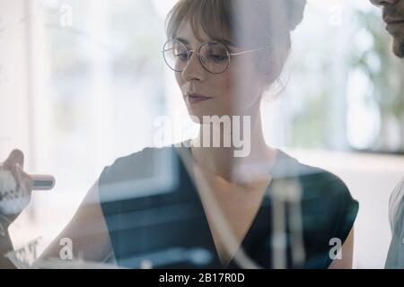 Businesswoman working on a project in office Stock Photo