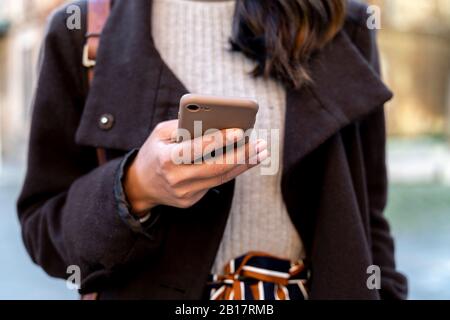 Close-up of woman holding smartphone Stock Photo