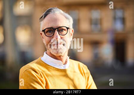 Portrait of confident mature man outdoors Stock Photo