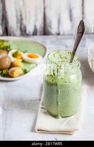 Jar of salsa verde sauce Stock Photo