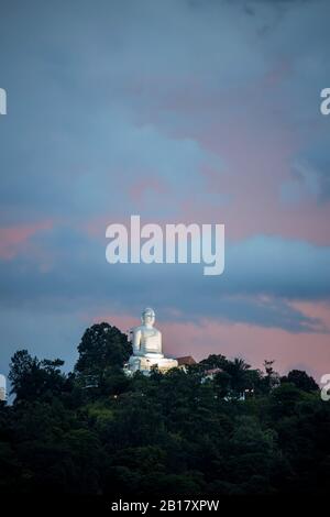 Sri Lanka, Central Province, Kandy, Buddha statue of Bahirawakanda Temple at dusk Stock Photo