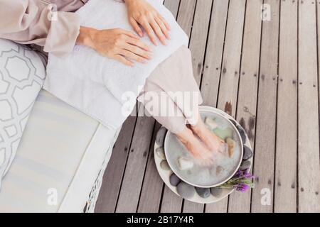 Close-up of woman having a footbath Stock Photo