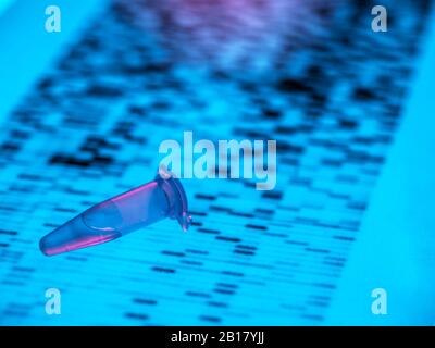 Close-up of DNA sample lying on DNA sequencing result chart Stock Photo