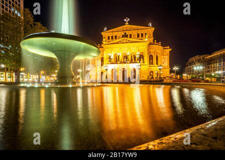 Germany, Hesse, Frankfurt, Fountain in front of Alte Oper at night Stock Photo