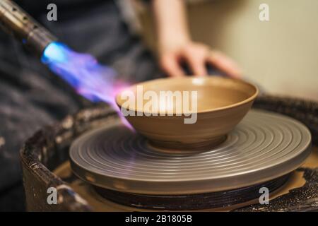 Close-up of potter working on workpiece Stock Photo