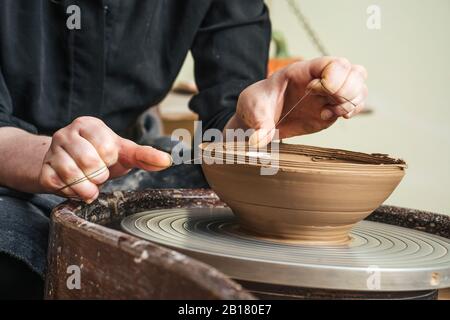 Close-up of potter working on workpiece Stock Photo