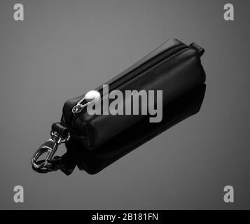 leather key case with zipper on black background Stock Photo