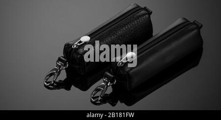 leather key case with zipper on black background Stock Photo