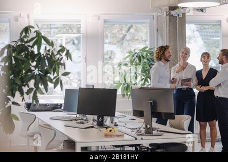 Confident business team having a meeting in office Stock Photo