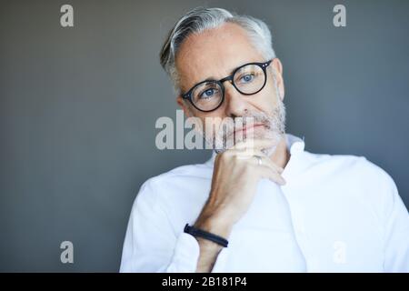 Portrait of mature man thinking Stock Photo