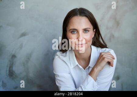 Portrait of confident woman wearing white shirt Stock Photo