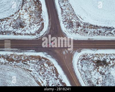 Russia, Moscow region, Aerial view of crossroad and snow covered fields Stock Photo