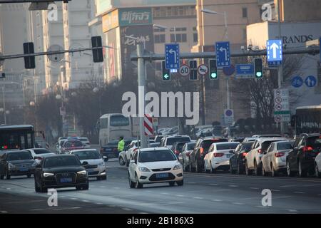 Cars and buses travel on the road during rush houses in Shenyang City, northeast China's Liaoning Province on February 24th, 2020. Stock Photo