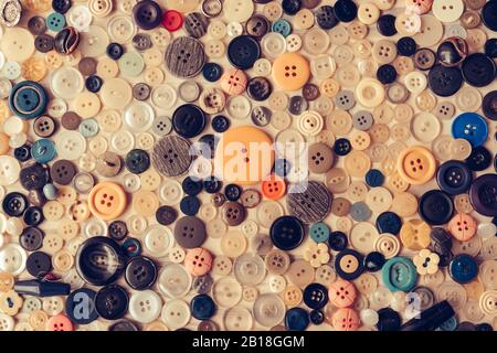 Sewing buttons of different size amd colors on isolated background Stock Photo
