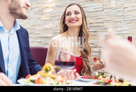 Patrons of Italian restaurant eating, drinking and chatting Stock Photo