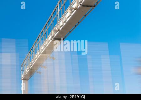 truck passing through a toll gate on a highway toll roads Stock Photo