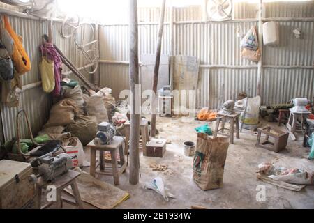 Kibera, Nairobi, Kenya - February 13, 2015: The working room of the factory for the production of souvenirs from bones Stock Photo