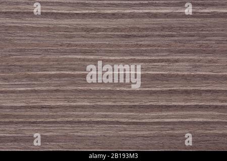 Natural nut veneer background in admirable grey hue. Stock Photo