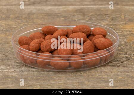 Sweets, Chocolate with milk and almonds with natural cocoa powder on wooden Background Stock Photo
