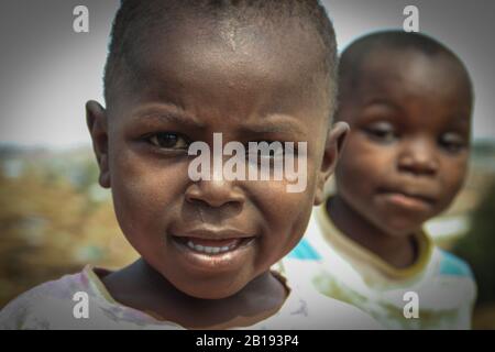 Kibera, Nairobi, Kenya - February 13, 2015: two poor black boys in the Kiber slums Stock Photo