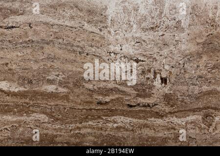 Dark brown travertine stone texture. Natural stone abstract background. Stock Photo