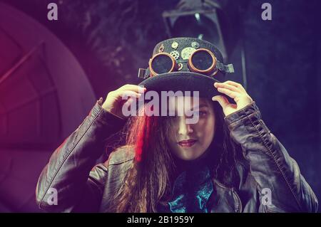 Beautiful steampunk teen girl  over vintage background , model in the style of a steampunk in a beautiful creative studio. Fashion, style Stock Photo