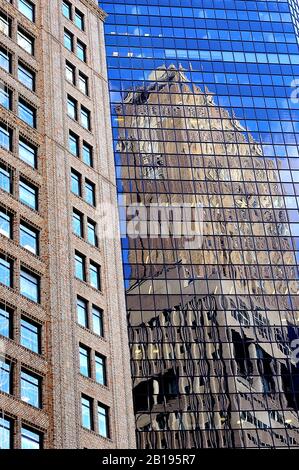 All glass skyscraper towers in New York City with reflections of other surrounding buildings, USA, America. Stock Photo