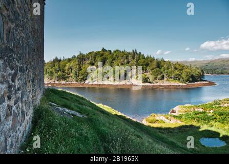 View from ruined ancient Castle Tioram on the tidal island of Eilean Tioram across Loch Moidart, Lochaber, Highland, Scotland Stock Photo