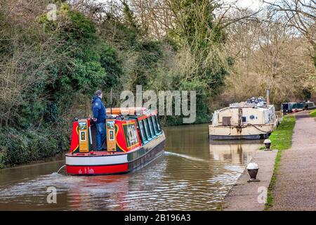 Narrow boats moored on the Grand Union Canal, on a cloudy and blustery afternoon, Stoke Bruerne, Northamptonshire, UK, Stock Photo