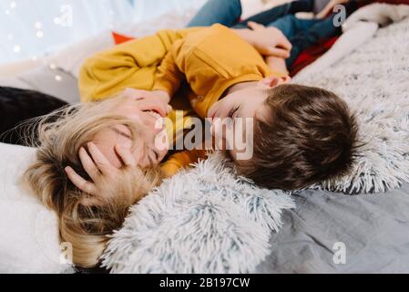 Family mother and son play in trailer. Mother's day greeting card Stock Photo