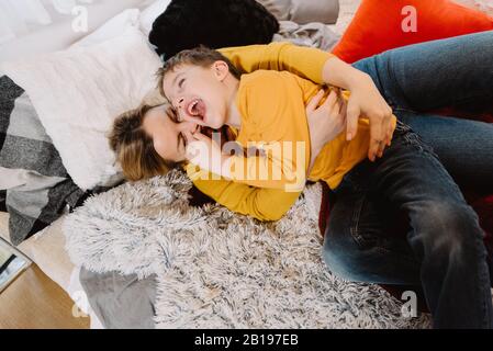 Family mother and son play in trailer. Mother's day greeting card Stock Photo
