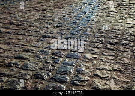 Stone road close-up at sunset Stock Photo