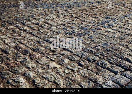 Stone road close-up at sunset Stock Photo