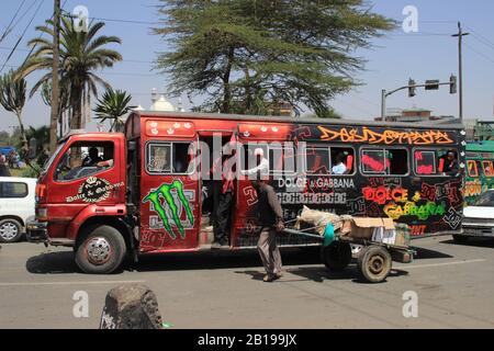 Nairobi, Kenya - January 17, 2015: Unusual painted red city bus in Nairobi. Stock Photo