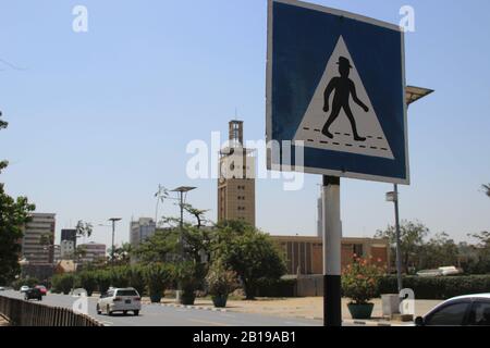 Nairobi, Kenya - January 17, 2015: Unusual African crosswalk sign on Nairobi street Stock Photo