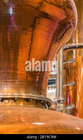 Copper Pot Still and other Equipment used in the process of making artisan gin and whisky at the Cotswold Distillery, Worcestershire, UK Stock Photo