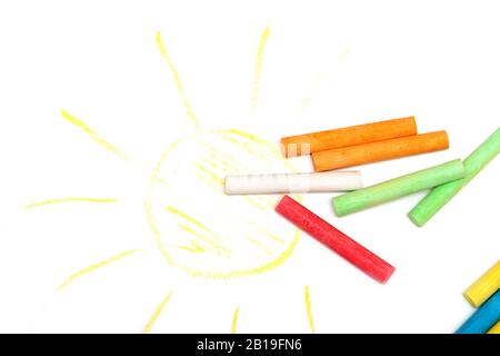 Colored crayons on a white sheet of paper Stock Photo