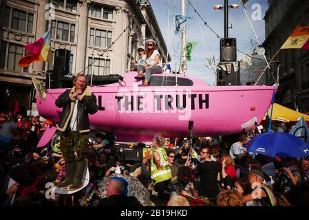 Extinction Rebellion, occupy London: Starting from Monday 15 April 2019, Extinction Rebellion organised demonstrations in London, focusing their attention on Oxford Circus, Marble Arch, Waterloo Bridge and the area around Parliament Square. Activists fixed a pink boat named after murdered Honduran environmental activist Berta Cáceres in the middle of the busy intersection of Oxford Street and Regent Street (Oxford Circus) and glued themselves to it and also set up several gazebos, potted plants and trees, a mobile stage and a skate ramp whilst also occupying Waterloo Bridge (ref:Wikipedia).